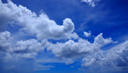 Naklejka na ściany i meble Blue sky with clouds closeup.
