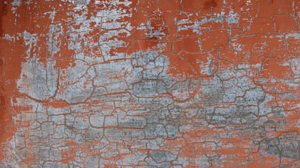 old brown wall with peeling paint and gray scuffs