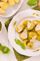Potato gnocchi stuffed with pesto sauce.
