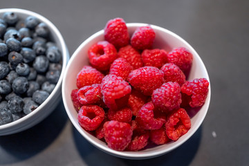 Fresh blueberries and raspberries in bowl