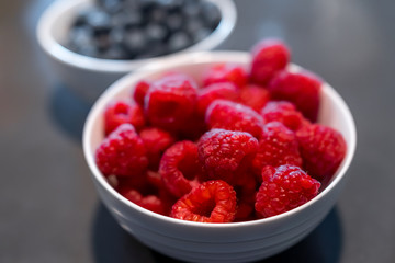 Fresh blueberries and raspberries in bowl