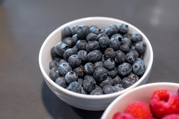 Fresh blueberries and raspberries in bowl
