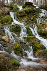 Fototapeta na wymiar City Cesis, Latvia. Old waterfall with green moss and dolomite rocks.