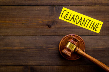 Quarantine fine. Judge hammer on wooden table top view copy space