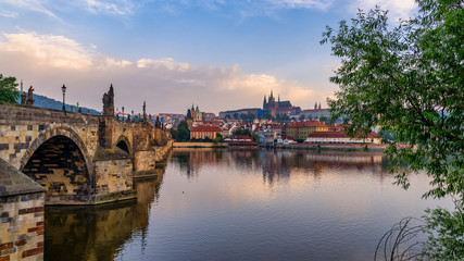 Panorama of the Old Town of Prague, Czech Republic, with a focus on Charles bridge and the Prague Castle seen from the Vltava river. 