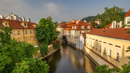 Fototapeta na wymiar Certovka Canal running through local neighbourhood in Prague, Czech Republic