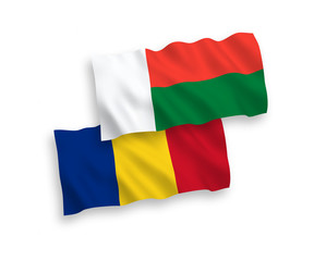 Flags of Romania and Madagascar on a white background