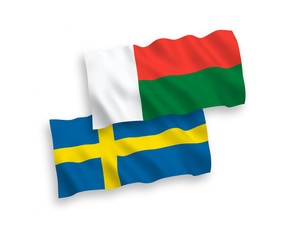 Flags of Sweden and Madagascar on a white background