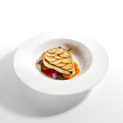 Fried flounder fillet on baked potato slices