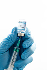A doctor is preparing the vaccine of Coronavirus for an infected person.