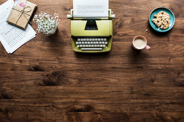 Aerial view of retro typewriter workspace concept and copy space