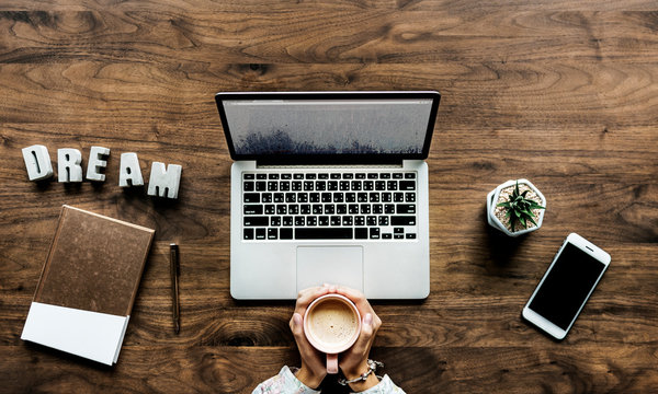 Aerial view of computer laptop on wooden table