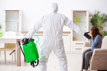 Young male contractor and female client during pest control