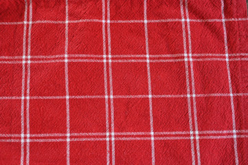 Fototapeta premium red fabric in a white cell. checkered red fabric texture.