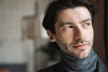 Obraz premium Close up of a handsome young bearded man