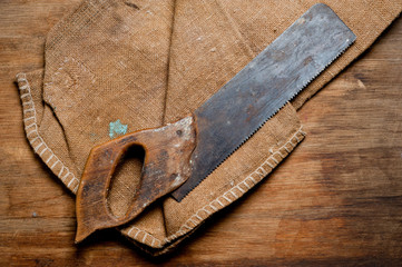 Old vintage saw of the last century extracted from the chest in the workshop of grandfather....