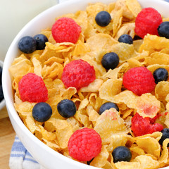 cereal in a white bowl on wooden background. Healthy breakfast concept.