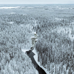 A river in winter at Oulanka National Park, Finland.