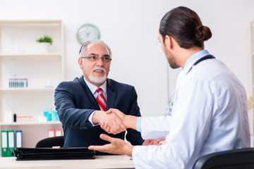 Male doctor and businessman discussing medical project