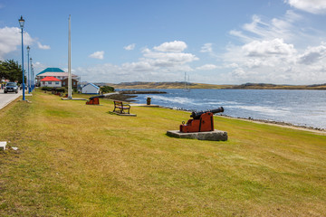 Fototapeta premium Port Stanley, Falkland Islands, guns on the waterfront. The cannon, which was part of the Arsenal of the old garrison at Port Louis 