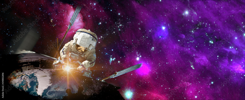 Canvas Prints astronaut in outer space over the planet earth repairs light. elements of this image furnished by na
