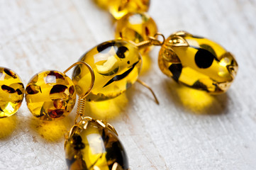 Bright yellow faux amber bracelet and earrings. Background for jewelry and women's jewelry.