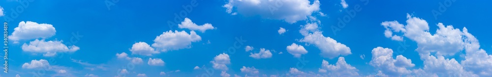 Wall mural panorama blue sky background with tiny clouds.