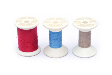spools of thread, Colorful yarn on spools isolated on a white