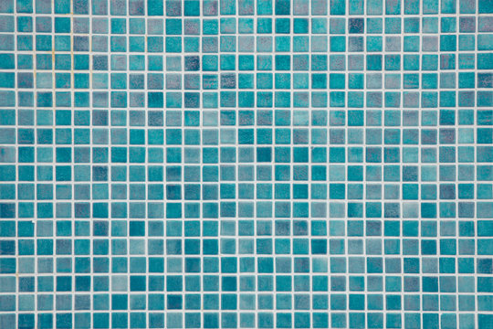 Aqua blue swimming pool mosaic tiles background, textured pool walls with copy space, a summer vacation inspiration, traveling to a tropical destination or relaxing holidays atmosphere concepts
