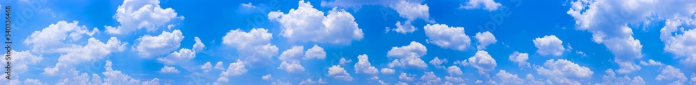Wall mural panorama blue sky background with tiny clouds.