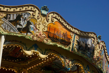 Details of a traditional Venetian carousel at the funfair.Carousel, traditional fairground ride.