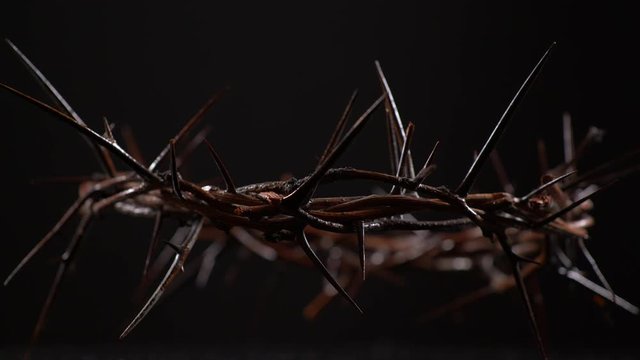 Crown of Thorns Spinning Counter Clockwise on Black Background. Communion