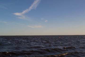 Fototapeta premium Sunset over the sea a bright summer day