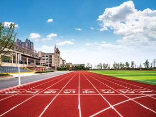Red track and field starting point on football field