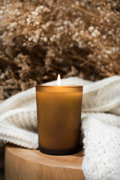 Candle on a wooden table