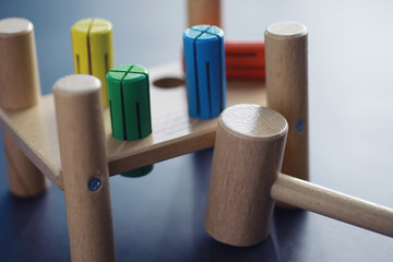 Children's development. Children's wooden toy on the table in the play area. Room of children's creativity and self-development. Wooden constructor.