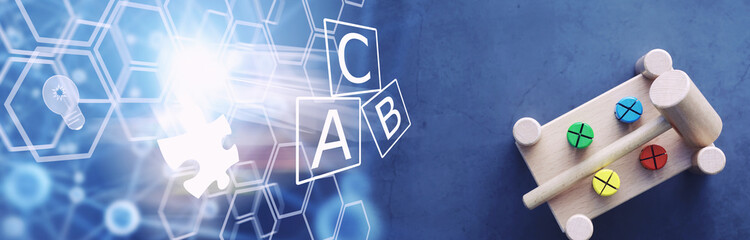 Children's development. Children's wooden toy on the table in the play area. Room of children's creativity and self-development. Wooden constructor.