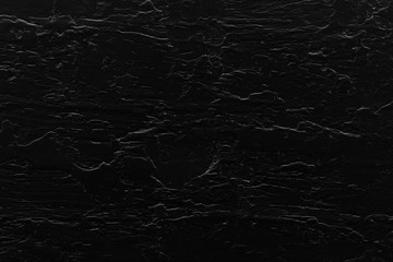 Black cracked textured wall background
