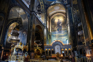 Fototapeta premium Interior of the St. Volodymyr's Cathedral with altar and fragments of frescoes wall paintings. Kyiv, Ukraine. April 2020