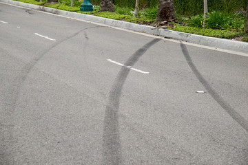 Skid marks from a street racing car crash. 