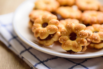 Cracker with pineapple jam (flower shape) on plate ready to eating, Thai snack