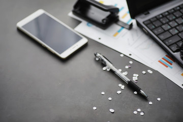 Working time symbolizes the desktop. Office desk with papers from an insurance manager and banker. Office worker at the table. The concept of lack of time.
