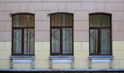 Fototapeta na wymiar Three Windows on the front of the house