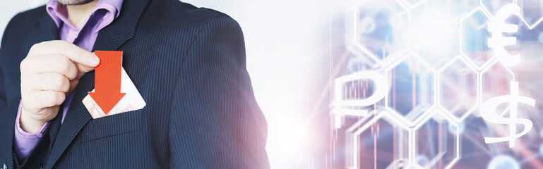 Financial crisis. Concept. Money bills in hand. Arrow symbol of the fall of the national currency. The change in the exchange rate between the Russian ruble and the US dollar.