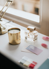 Feminine perfume bottle and candle