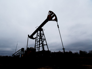 Green Oil pump oil rig energy industrial machine for petroleum crude. oil crisis. Russia pumps oil...