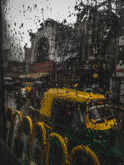 yellow auto in the rain.