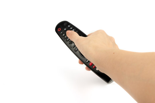 black remote control in hand isolated on white background