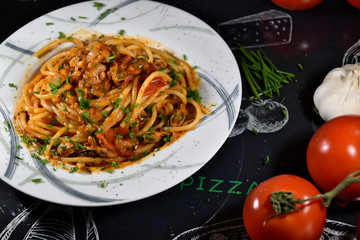 Spaghetti Pescatore Italian Style with Tomatoes and Garlic