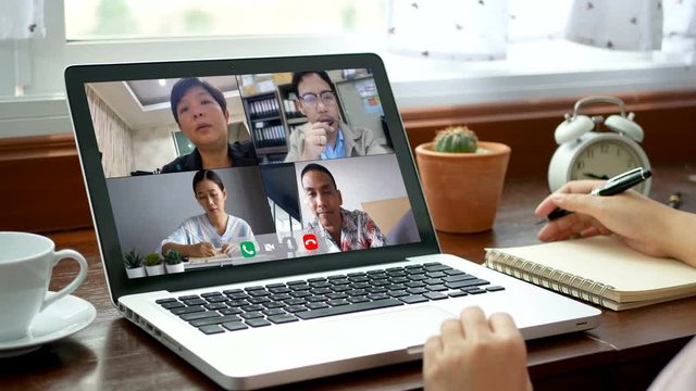 4K. work from home. people making video conference with colleagues via laptop computer during self isolated to avoid spreading illness transmission of COVID-19 Coronavirus outbreak. home quarantine